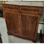 A period style crossbanded side cabinet in hardwood enclosed by 2 doors and a similar mahogany