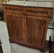 A period style crossbanded side cabinet in hardwood enclosed by 2 doors and a similar mahogany