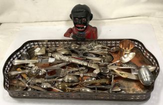 A copper gallery tray, decorative cutlery and a cast metal Black Boy money box