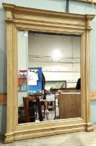 A large rectangular pine framed wall mirror