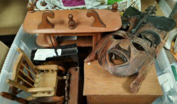 A collection of treen including carved masks, miniature furniture etc