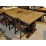 An early 20th century Elizabethan style oak dining suite on carved bulbous legs comprising