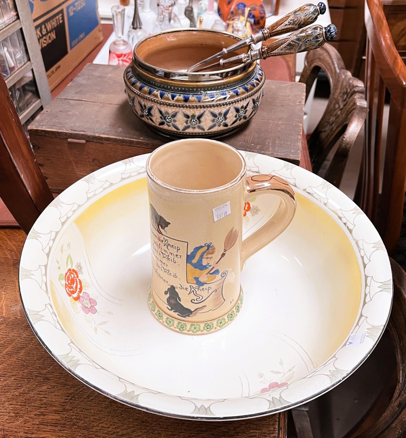 A Royal Doulton stoneware salad bowl and servers; a German musical stein and a large washbowl