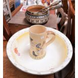 A Royal Doulton stoneware salad bowl and servers; a German musical stein and a large washbowl