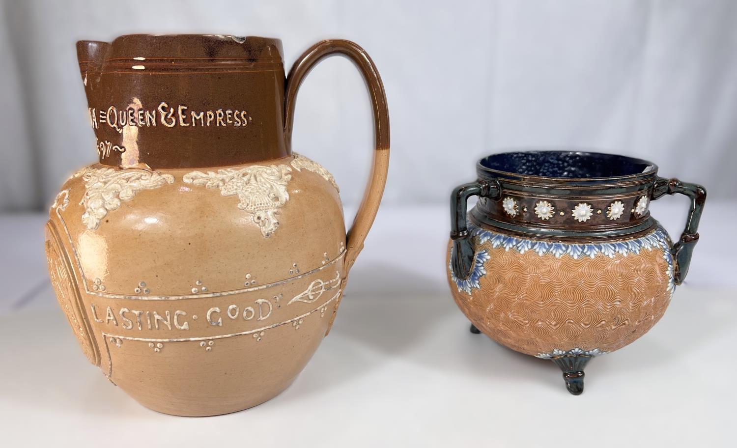 A Doulton brown stoneware jug commemorating Queen Victoria's Diamond Jubilee 1897, ht. 20cm (spout