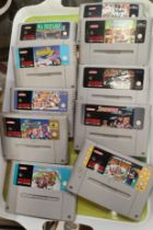 A collection of Super Nintendo video games Mario Kart, Star Wing etc