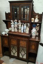 A 19th century full height rosewood side cabinet with mirror back and extensive marquetry inlay, the