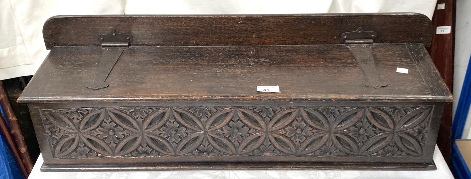 A 19th century carved oak wall handing candle box