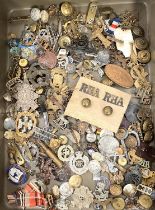 A large selection of early to late 20th century military badges and buttons