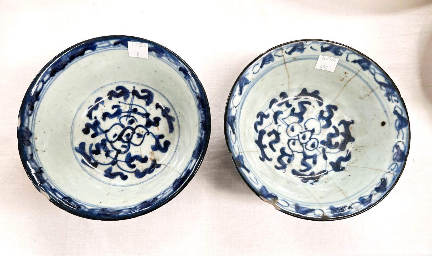 Two Chinese bowls blue and white decoration with seal marks to base (chips to rim)