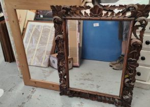 A 19th century rectangular wall mirror in carved frame; a pine framed wall mirror