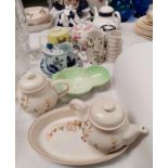 A collection of teapots and decorative china