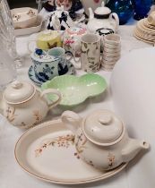 A collection of teapots and decorative china