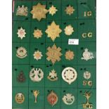 A collection on board of Military guard badges, Manchester etc