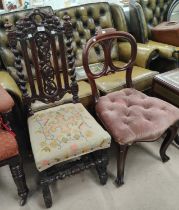 A Carolean style dining chair in carved oak with barley twist columns; a balloon back chair; a