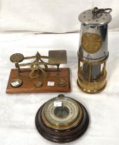 A Protector "Type 1A" miner's lamp; a set of 19th century postal scales; a small barometer