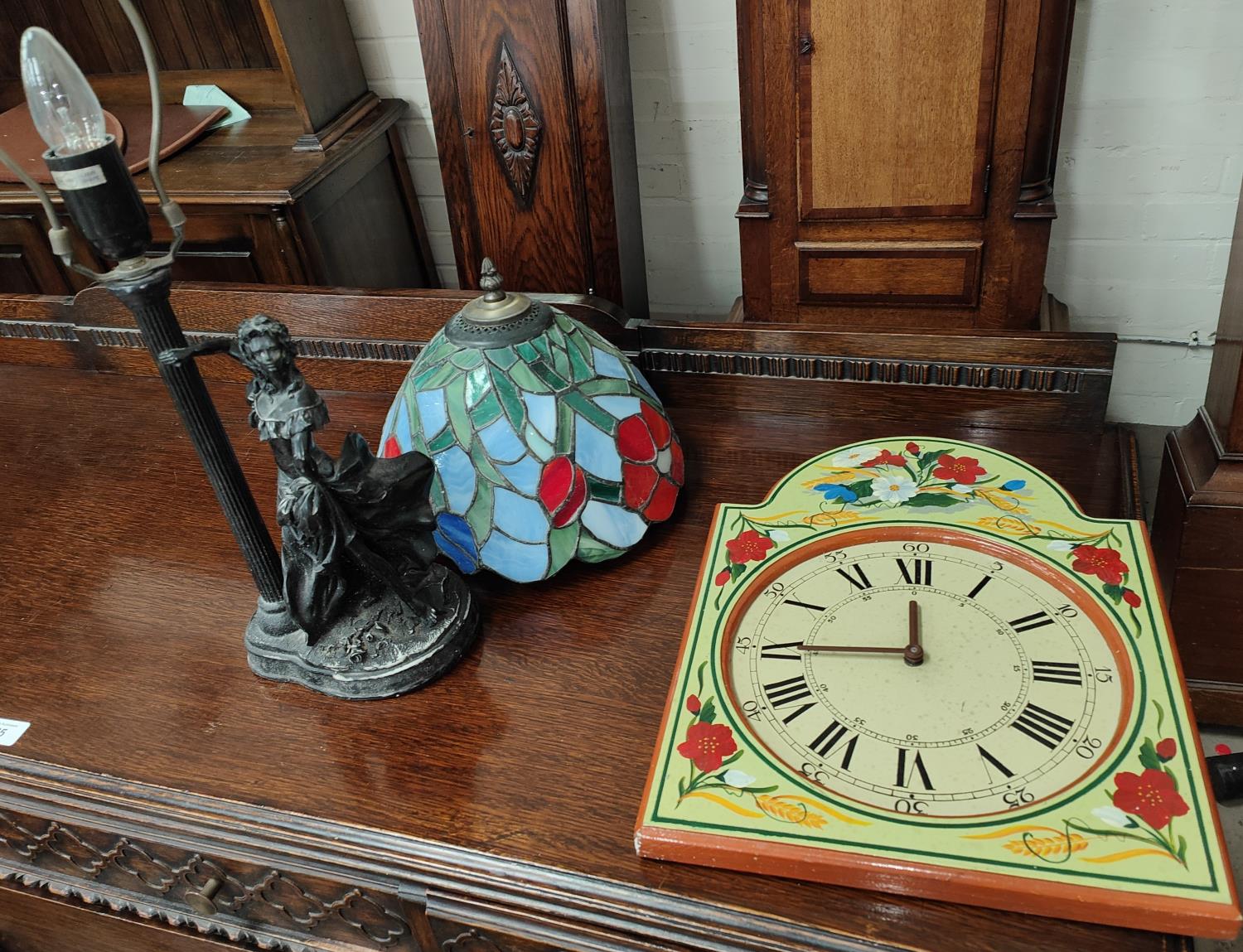 A Tiffany lamp and a painted dial wall clock