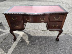 A Georgian style mahogany kneehole desk with inset red leather scriber, gadrooned rim, 5 drawers,