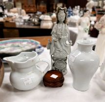 Three pieces of blanc de chine china, a Chinese incised baluster vase with dragons, on stand, height