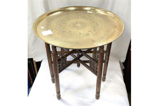 A 19th / 20th century Eastern brass table with folding wood legs - Image 3 of 3