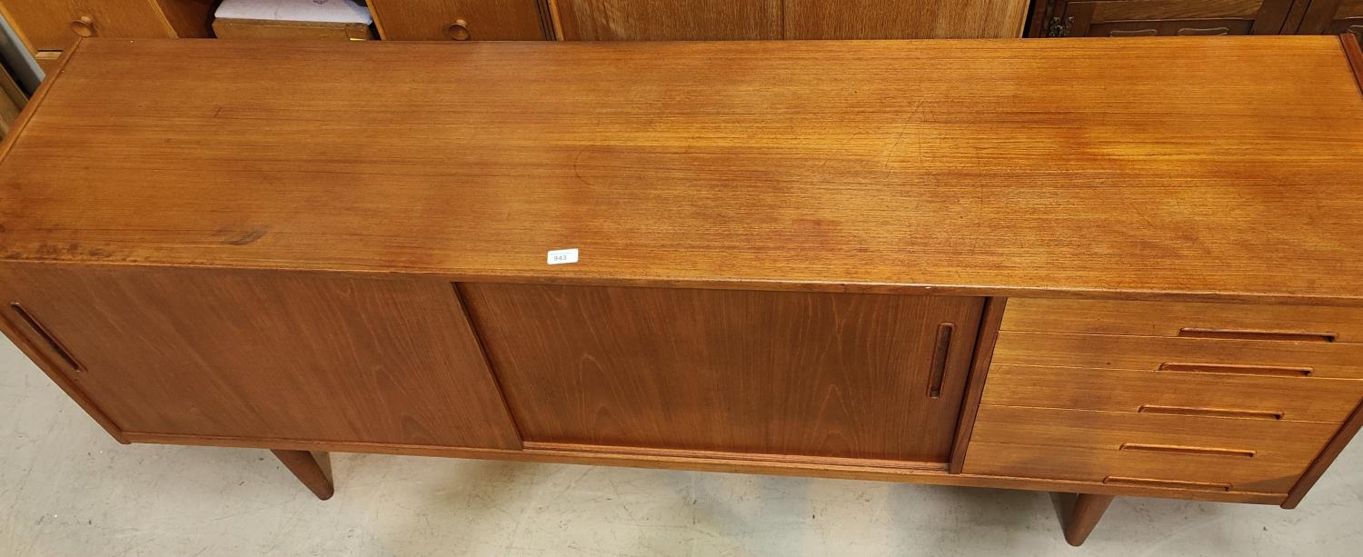 A 1960's G-Plan style teak sideboard with 2 sliding doors and 4 drawers - Image 4 of 4