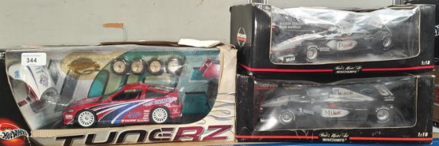 Two Mini Champs Paul's Model Art 1/18 scale Maclaren F1 Cars in boxes (boxes worn) and a Hot