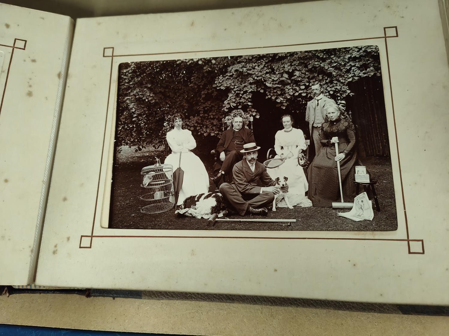 A MOST INTERESTING COUNTRY ESTATE photograph album to include images of skeletons, bicycle riders, a