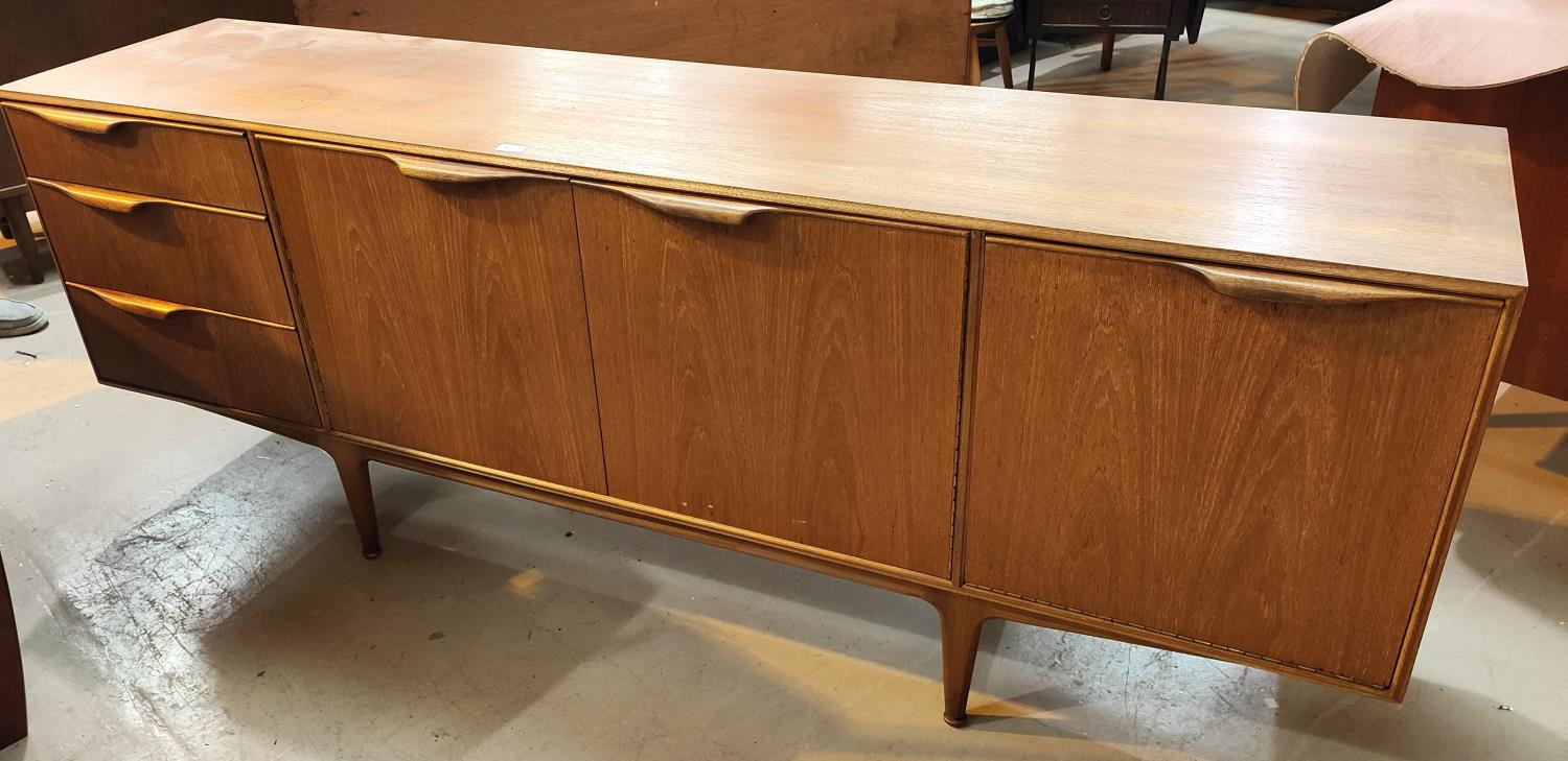 A 1960's teak lowline sideboard by Mackintosh with 3 cupboards and 3 drawers
