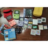 Two Nintendo Game Boy Colors, a Game Boy Advance SP, various games, Pokemon Blue, Emerald, etc