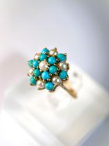A 9 carat hallmarked gold ring with seed pearls and turquoise in tiered setting, 3.4gm, size N/M