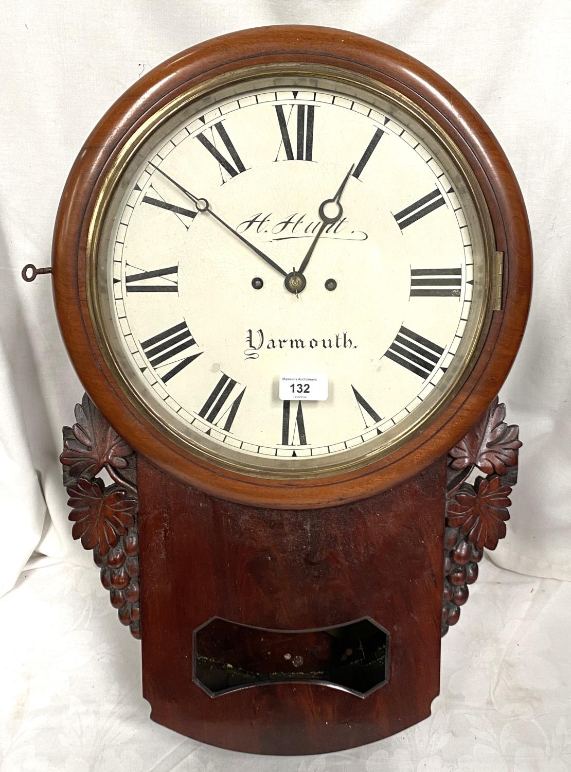 A 19th century mahogany cased drop dial wall clock with vince carved side mounts, twin chain fusee