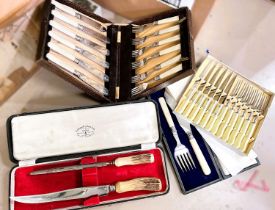 2 cased sets of silver plated servers and 2 cased sets of silver plated knives and forks; an