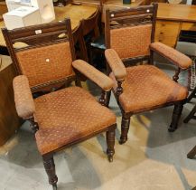 A pair of Edwardian arm chairs, aesthetic movement look, cushioned upholstery