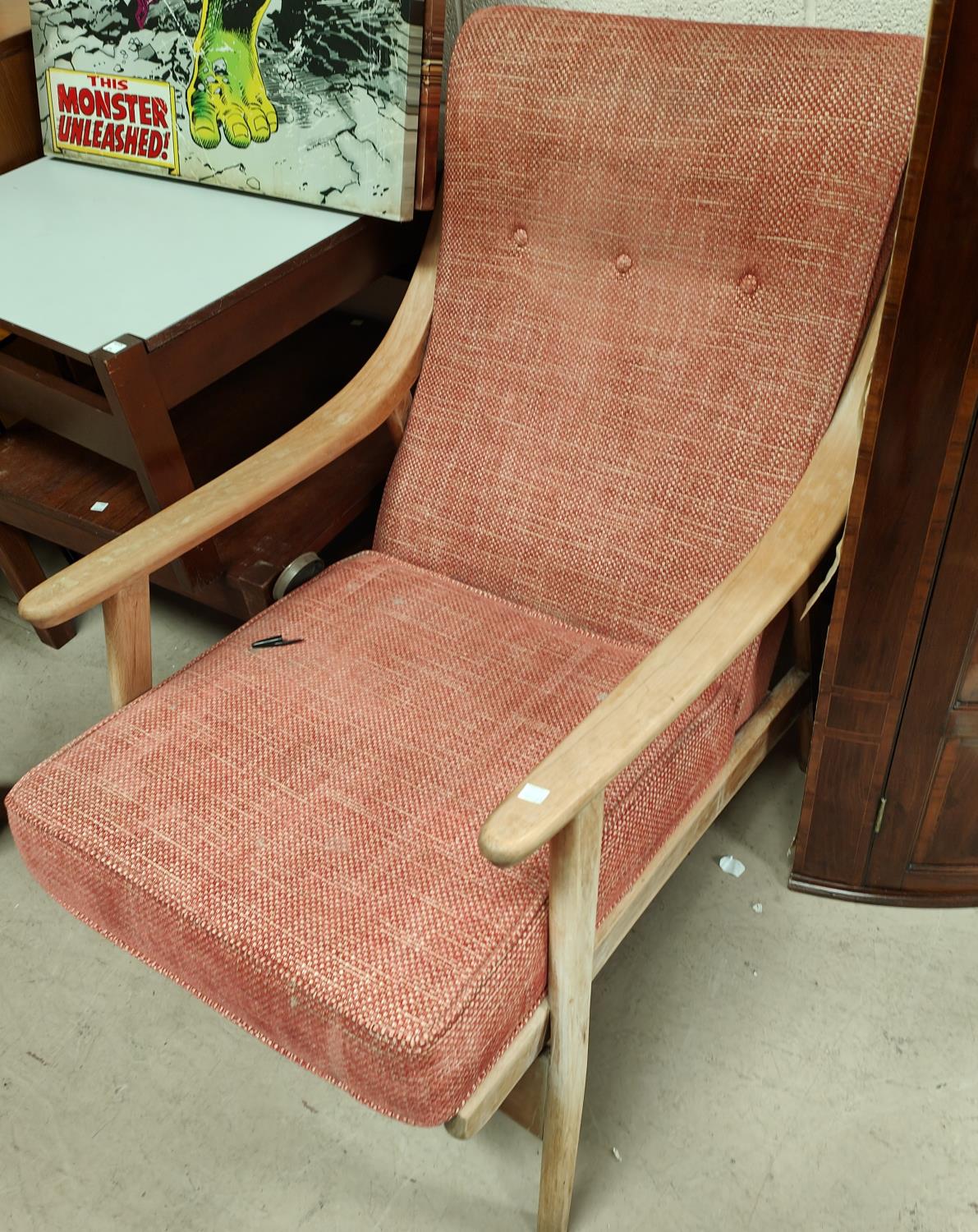 A 1960's lightwood cable sprung armchair in red
