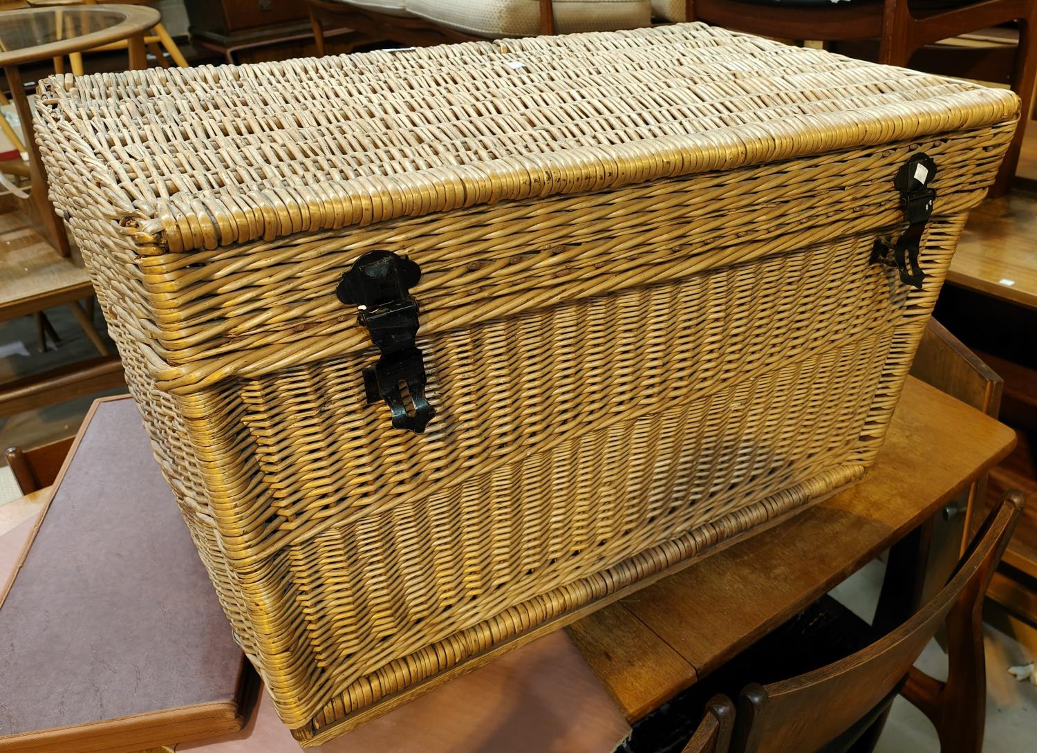 A large wicker linen hamper