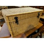 A large wicker linen hamper