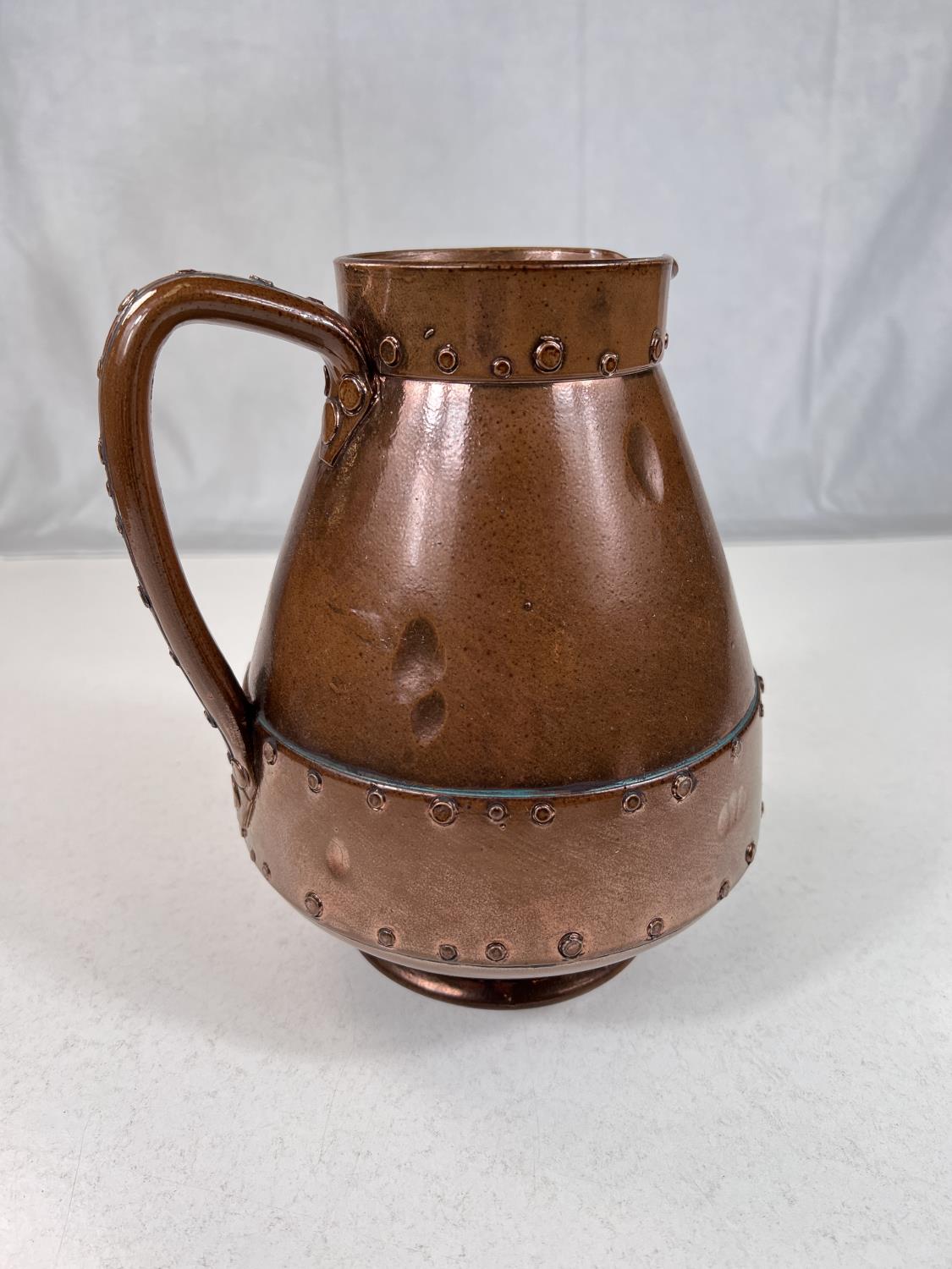 An unusual Arts & Crafts jug by Doulton Silicon in copper coloured finish with rivet decoration, ht. - Image 2 of 5