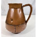 An unusual Arts & Crafts jug by Doulton Silicon in copper coloured finish with rivet decoration, ht.