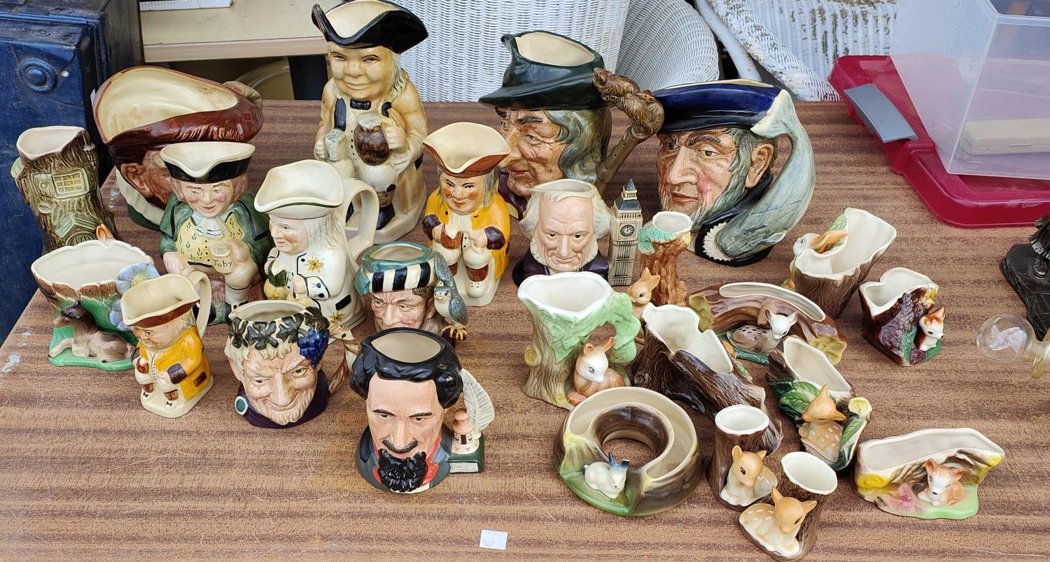 A collection of Royal Doulton character jugs, varying sizes including a limited edition of Charles