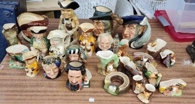 A collection of Royal Doulton character jugs, varying sizes including a limited edition of Charles