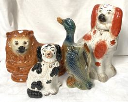 A large 19th century Staffordshire dog (a.f), a smaller dog, cat and duck