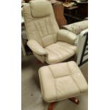 A "Mobel Team" swivel rocking chair with stool in cream hide