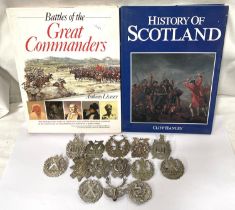 A collection of military badges including Scottish examples etc and two hardback books