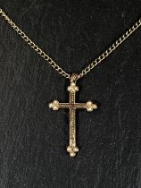 A seed pearl and ruby set yellow metal cross pendant stamped 375 on curb link chain stamped 375, 9gm