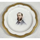 A hand painted cabinet plate with head and shoulders portrait of a young man, signed for Antonin