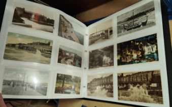 A large album of early and later 20th century post cards, seaside views and towns