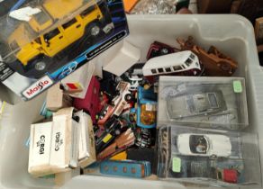 A collection of boxed and loose diecast vehicles including James Bond models
