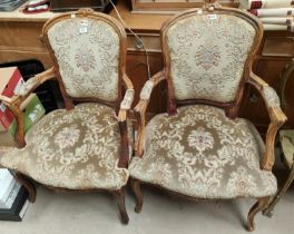 A pair of mid 20th century Louis XV style armchair re-upholstered in floral fabric