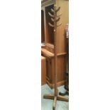 A mid 20th century stained wood hat and coat stand