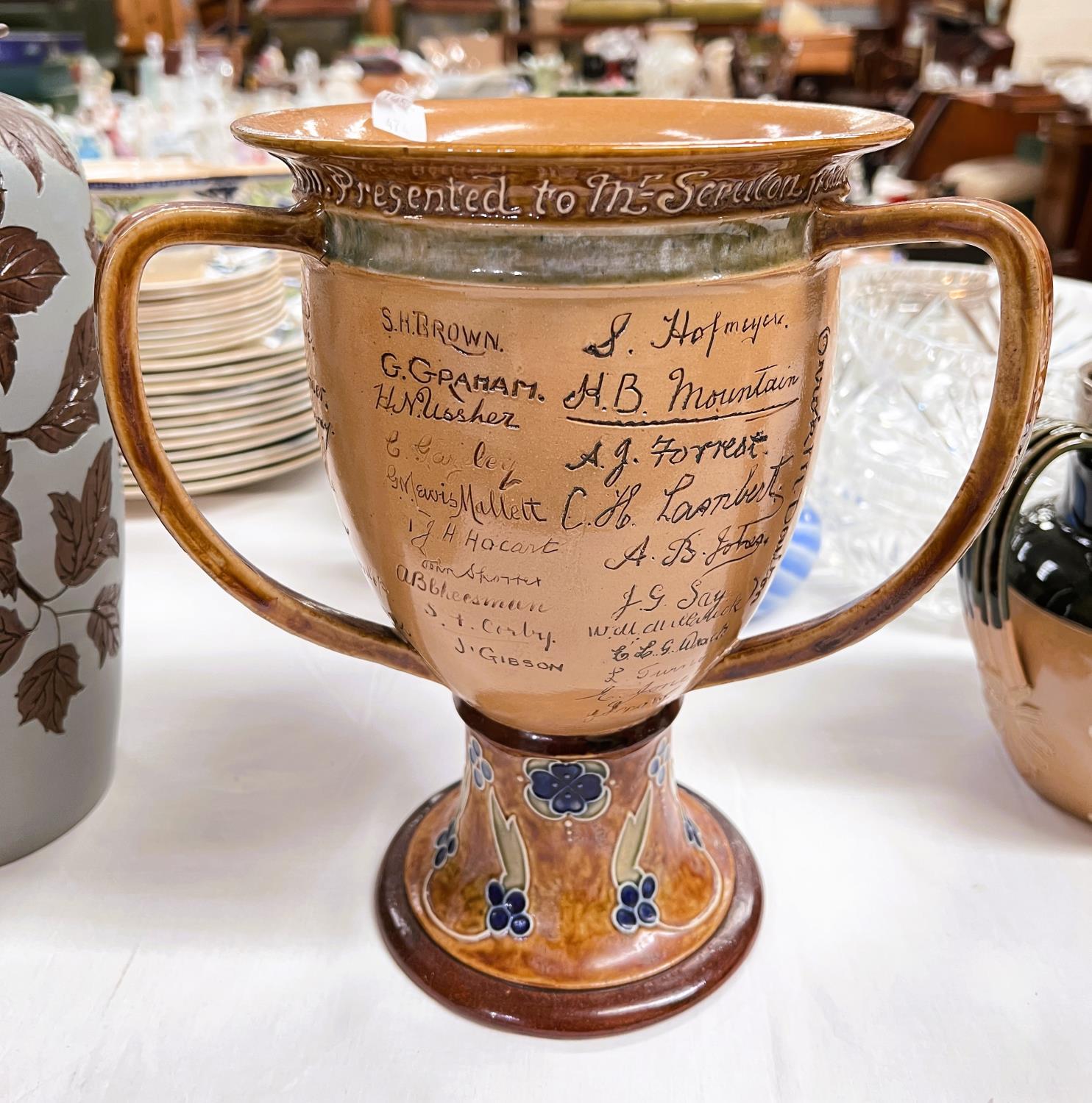 An unusual Royal Doulton stoneware "Tigg" with dedication to "Mr Scruton" and signatures of all